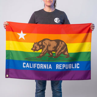 flag designer Emma holding a 'California Republic' Pride Flag in 2x3ft