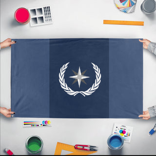 A mockup of the custom flag 'Bloxian flag' held up on a table during print checking