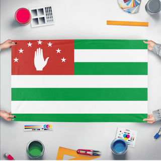 A mockup of the custom flag 'Abkhazia flag' held up on a table during print checking