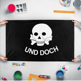 A mockup of the custom flag 'Frei Korp flag' held up on a table during print checking