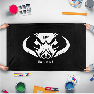 A mockup of the custom flag 'HW flag' held up on a table during print checking