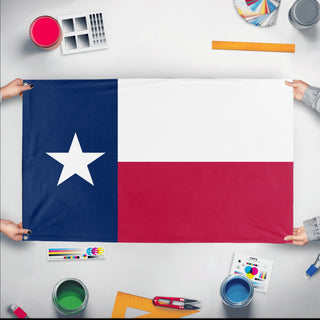 A mockup of the custom flag 'Texas State flag' held up on a table during print checking