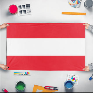 A mockup of the custom flag 'Austria flag' held up on a table during print checking