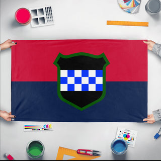A mockup of the custom flag '99th RD flag' held up on a table during print checking