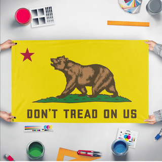 A mockup of the custom flag 'DTOU flag' held up on a table during print checking