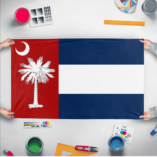 A mockup of the custom flag 'Carolina' held up on a table during print checking