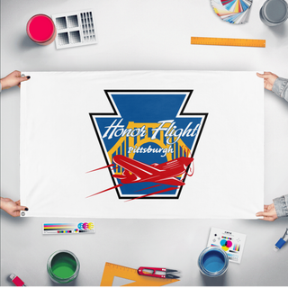 A mockup of the custom flag 'HFP-White flag' held up on a table during print checking