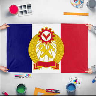 A mockup of the custom flag 'Commune of France flag' held up on a table during print checking