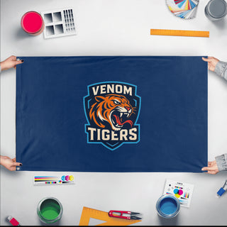 A mockup of the custom flag 'venomtigers flag' held up on a table during print checking