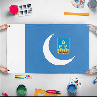 A mockup of the custom flag 'Farman flag' held up on a table during print checking