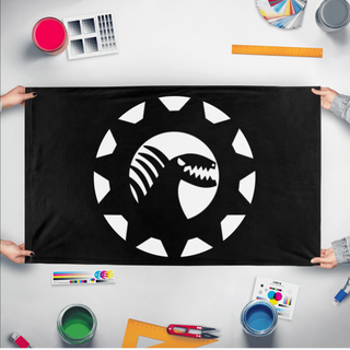 A mockup of the custom flag 'monster engieering flag' held up on a table during print checking