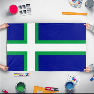 A mockup of the custom flag 'Carrlandic flag' held up on a table during print checking
