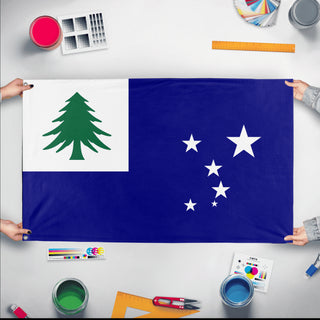 A mockup of the custom flag 'test flag' held up on a table during print checking