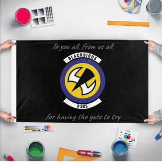 A mockup of the custom flag '8 SOS flag' held up on a table during print checking