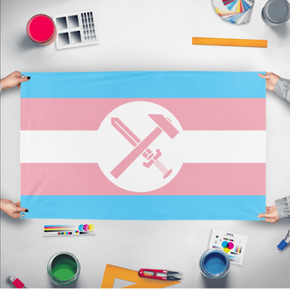 A mockup of the custom flag 'Trans Strasserist flag' held up on a table during print checking