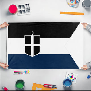 A mockup of the custom flag 'Kamorrian Naval Ensign flag' held up on a table during print checking