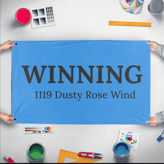 A mockup of the custom flag '1119 flag' held up on a table during print checking