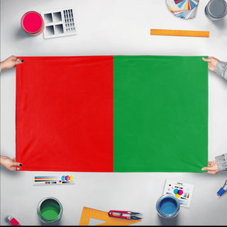 A mockup of the custom flag 'test6 flag' held up on a table during print checking
