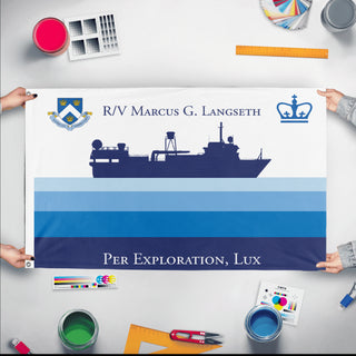 A mockup of the custom flag 'LDEO MGL Expedition Flag' held up on a table during print checking