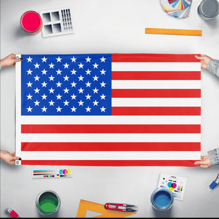 A mockup of the custom flag 'Flag of the US flag' held up on a table during print checking