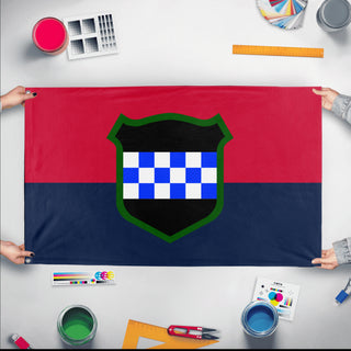 A mockup of the custom flag '99th RD flag' held up on a table during print checking