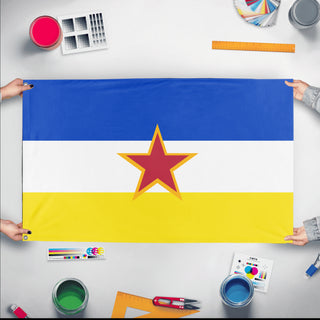 A mockup of the custom flag 'SR Gabrielland Table flag' held up on a table during print checking