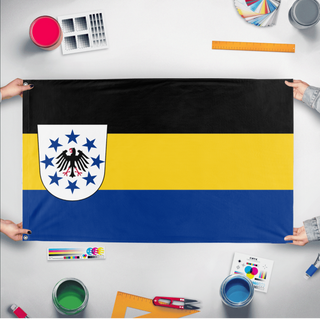 A mockup of the custom flag 'The Reichstaat of Blaukrone flag' held up on a table during print checking