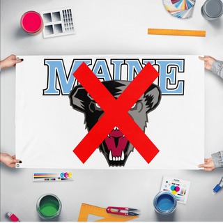 A mockup of the custom flag 'umainesucks flag' held up on a table during print checking