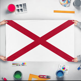 A mockup of the custom flag 'Alabama State Flag' held up on a table during print checking