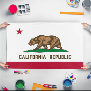 A mockup of the custom flag 'California State Flag' held up on a table during print checking