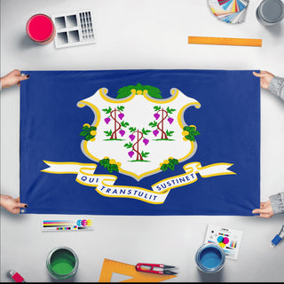 A mockup of the custom flag 'Connecticut State Flag' held up on a table during print checking