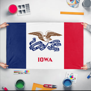 A mockup of the custom flag 'Iowa State Flag' held up on a table during print checking