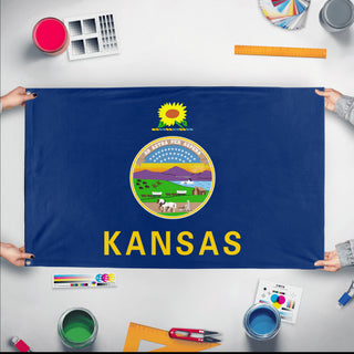 A mockup of the custom flag 'Kansas State Flag' held up on a table during print checking