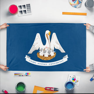 A mockup of the custom flag 'Louisiana State Flag' held up on a table during print checking