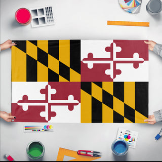 A mockup of the custom flag 'Maryland State Flag' held up on a table during print checking