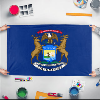 A mockup of the custom flag 'Michigan State Flag' held up on a table during print checking