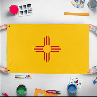 A mockup of the custom flag 'New Mexico State Flag' held up on a table during print checking