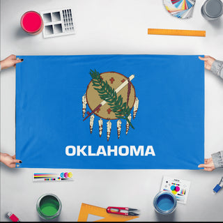 A mockup of the custom flag 'Oklahoma State Flag' held up on a table during print checking