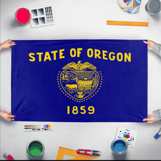 A mockup of the custom flag 'Oregon State Flag' held up on a table during print checking