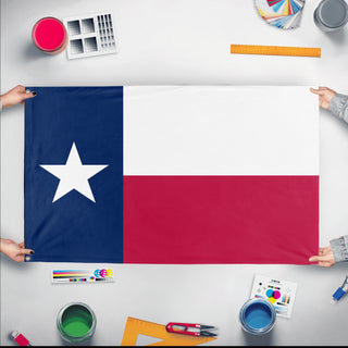 A mockup of the custom flag 'Texas State Flag' held up on a table during print checking