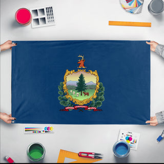 A mockup of the custom flag 'Vermont State Flag' held up on a table during print checking