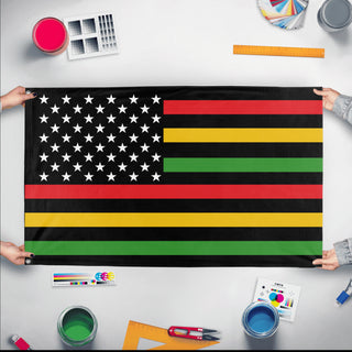 A mockup of the custom flag 'African American Flag' held up on a table during print checking