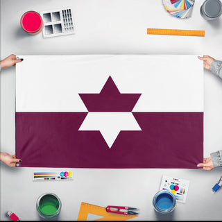 A mockup of the custom flag 'Jewish American Heritage Flag' held up on a table during print checking