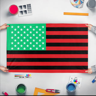 A mockup of the custom flag 'Pan-African Black Lives Matter Flag' held up on a table during print checking