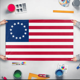A mockup of the custom flag 'Betsy Ross Flag' held up on a table during print checking