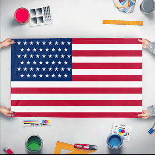 A mockup of the custom flag '51-Star Flag' held up on a table during print checking