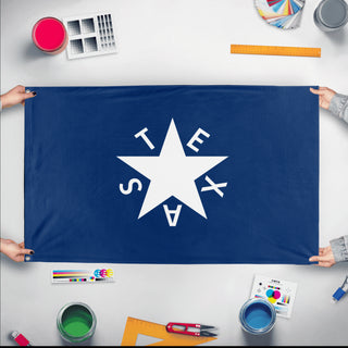 A mockup of the custom flag 'De Zavala Texas Flag' held up on a table during print checking