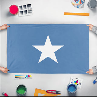 A mockup of the custom flag 'Republic of West Florida Flag' held up on a table during print checking