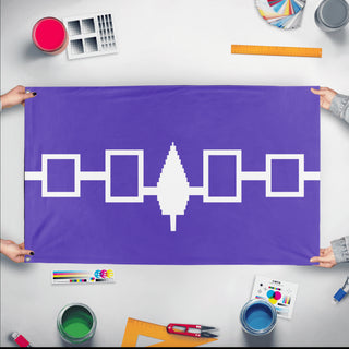 A mockup of the custom flag 'Haudenosaunee Confederacy Flag' held up on a table during print checking