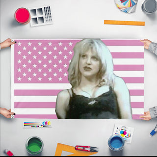 A mockup of the custom flag 'courtney love flag' held up on a table during print checking